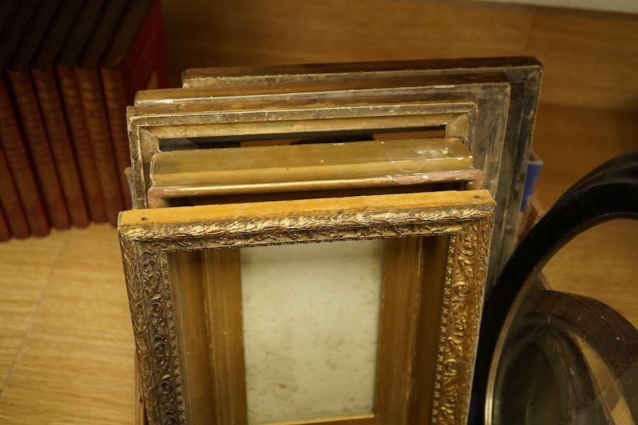A box of variously-sized rectangular and oval picture frames, largest 29cm high x 24cm wide